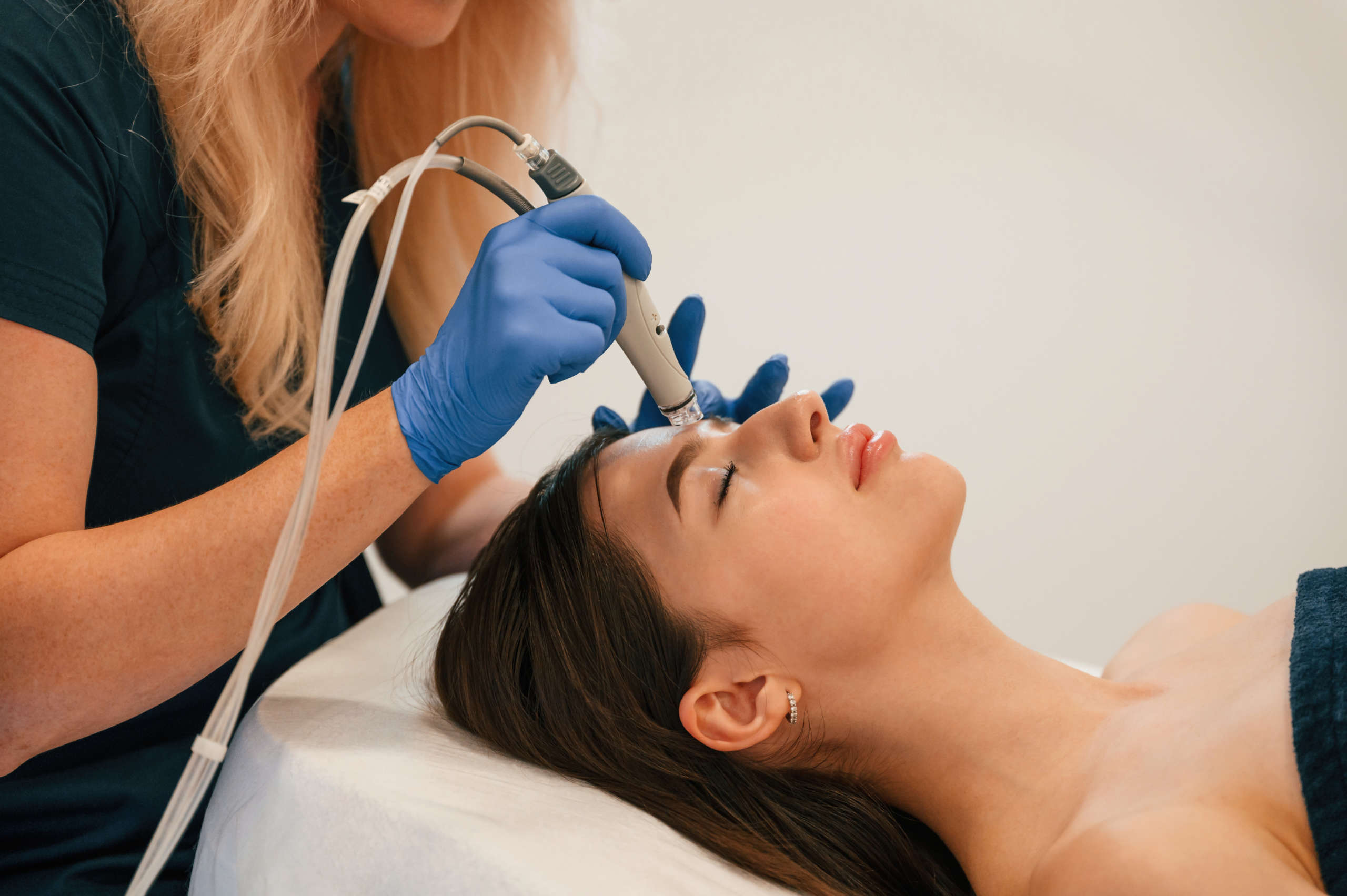 procedure on the face. getting photo rejuvenation at cosmetology clinic. women in beauty salon
